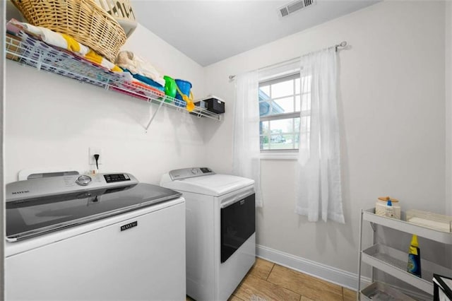 washroom featuring washing machine and dryer