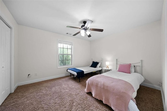 bedroom with carpet flooring, a closet, and ceiling fan