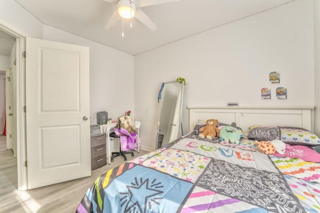 bedroom with ceiling fan and light wood-type flooring