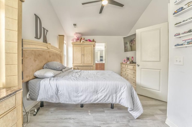 bedroom with vaulted ceiling, ceiling fan, and light hardwood / wood-style flooring