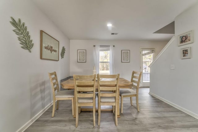 dining space featuring light hardwood / wood-style floors