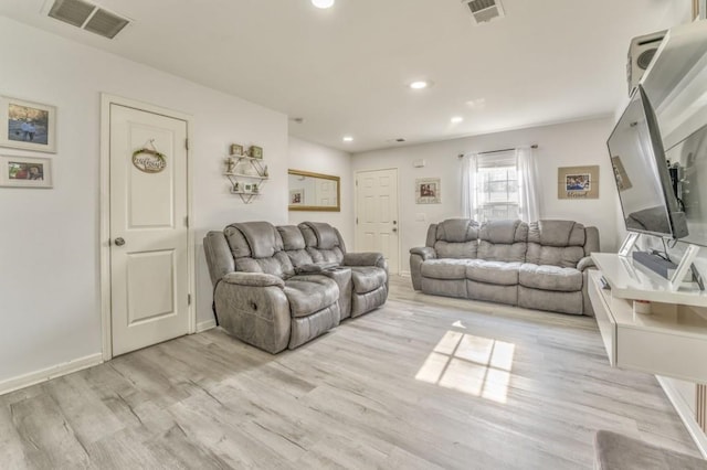 living room with light hardwood / wood-style flooring