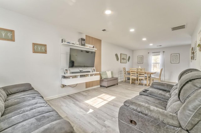 living room with light hardwood / wood-style floors