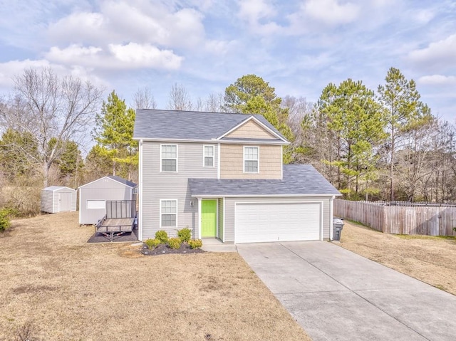 view of front of home with a garage, a front yard, and a storage unit