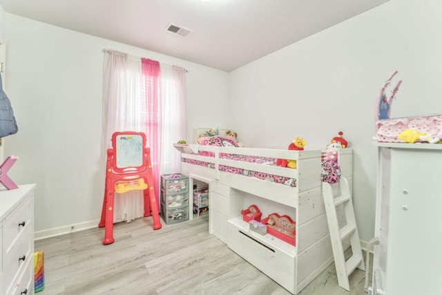 bedroom featuring light wood-type flooring