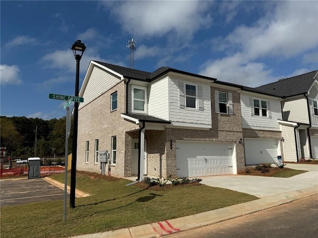 view of front of house featuring a garage and a front yard