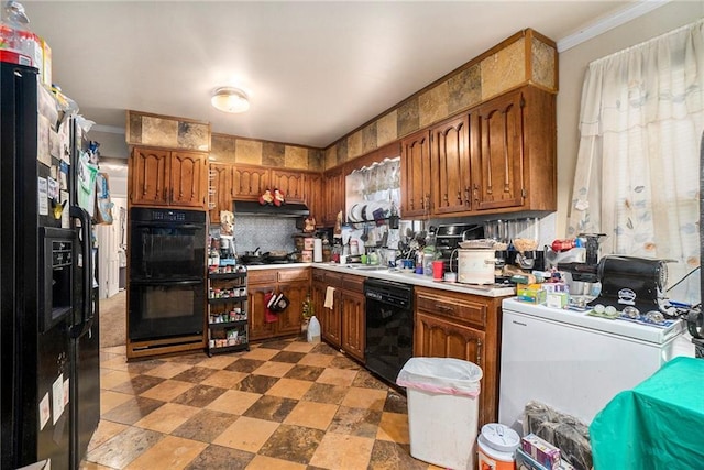 kitchen with black appliances, ornamental molding, and sink