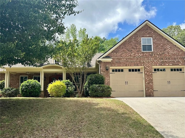 3397 Holly Glen Dr, Dacula, GA 30019 - view of front of home featuring concrete driveway, a front yard, brick siding, and a garage