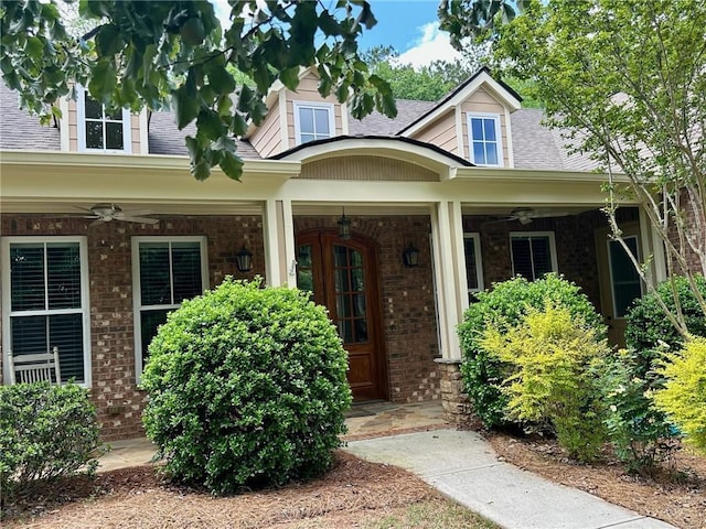 3397 Holly Glen Dr, Dacula, GA 30019 - entrance to property featuring ceiling fan, covered porch, and brick siding