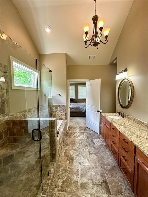 3397 Holly Glen Dr, Dacula, GA 30019 - full bath with a stall shower, a chandelier, vanity, and vaulted ceiling