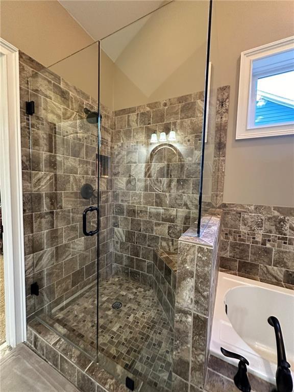 3397 Holly Glen Dr, Dacula, GA 30019 - full bathroom featuring a stall shower and a bath