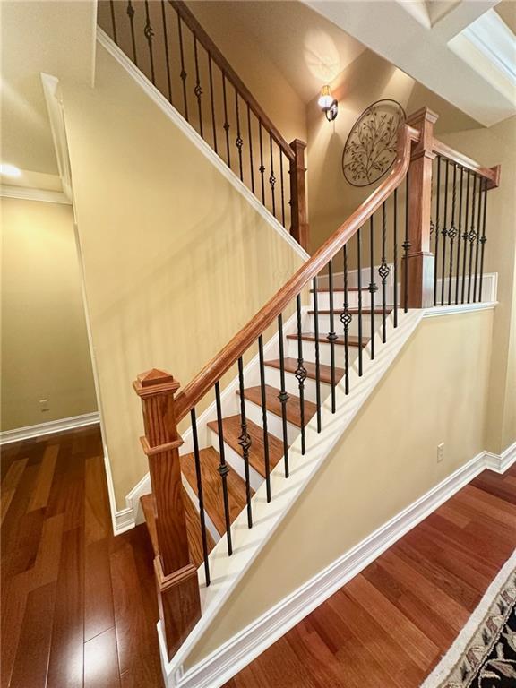 3397 Holly Glen Dr, Dacula, GA 30019 - staircase with baseboards and wood finished floors