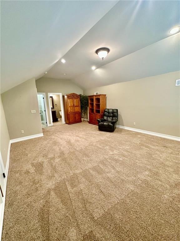 3397 Holly Glen Dr, Dacula, GA 30019 - bonus room featuring carpet flooring, baseboards, and lofted ceiling