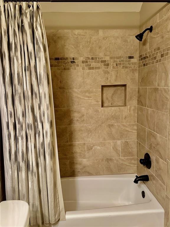 3397 Holly Glen Dr, Dacula, GA 30019 - full bath with shower / bathtub combination with curtain and toilet
