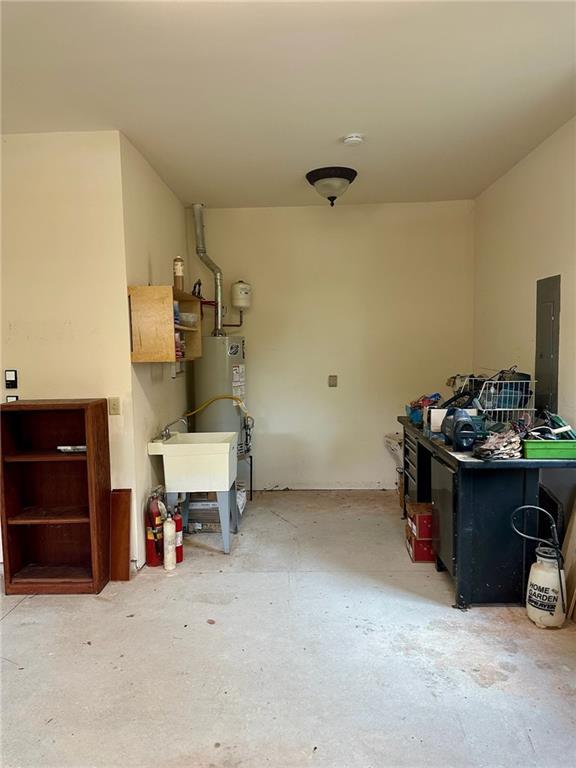 3397 Holly Glen Dr, Dacula, GA 30019 - garage with a sink, electric panel, and water heater