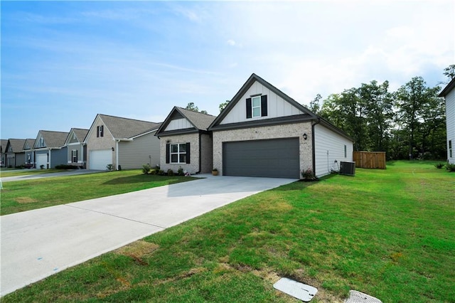 view of front of house with a garage, board and batten siding, a front yard, and cooling unit