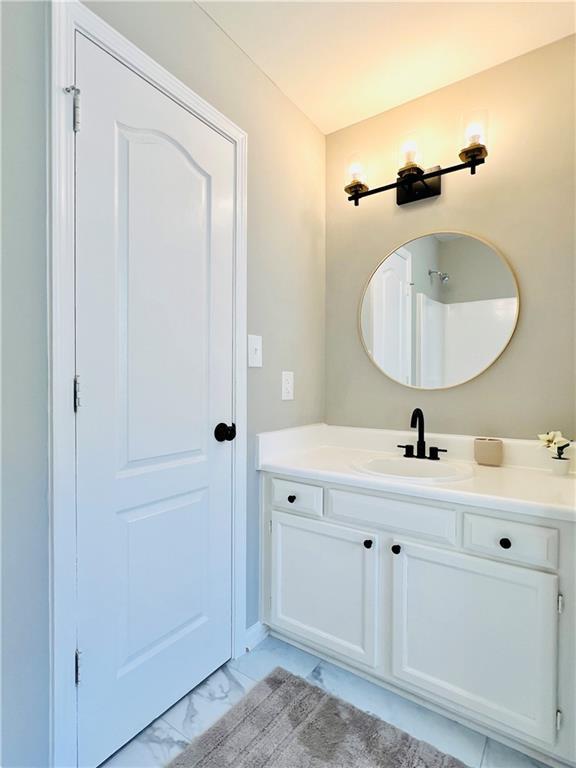 430 Thornbush Trce, Lawrenceville, GA 30046 - bathroom featuring vanity and marble finish floors