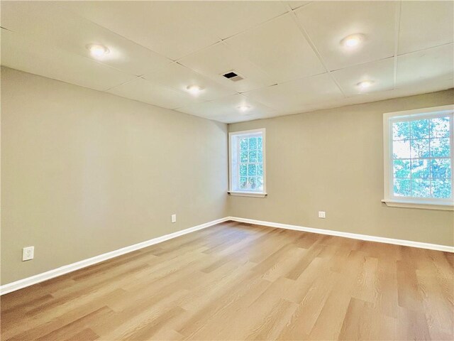 430 Thornbush Trce, Lawrenceville, GA 30046 - spare room with wood finished floors and healthy amount of natural light