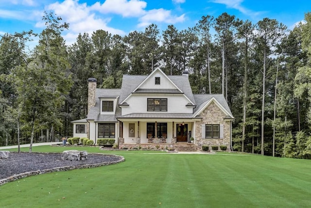 view of front of home featuring a porch and a front yard