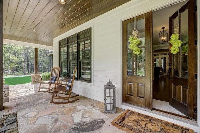 property entrance featuring covered porch