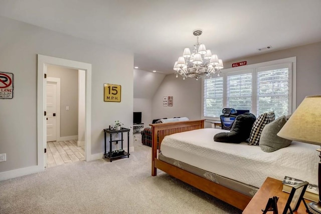 bedroom featuring lofted ceiling, light carpet, and an inviting chandelier