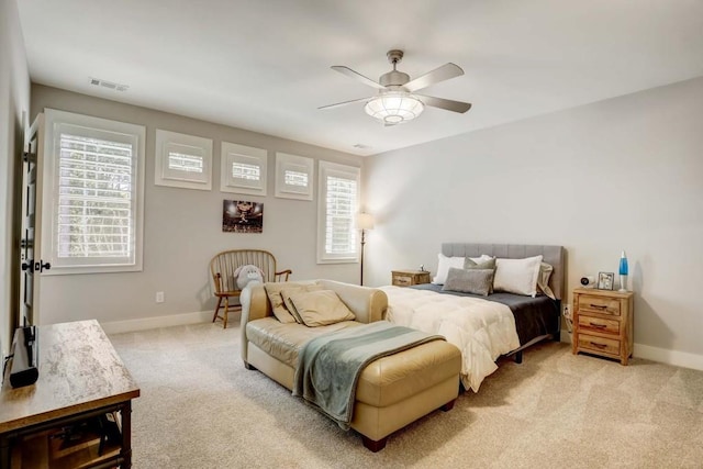 bedroom featuring ceiling fan and light colored carpet