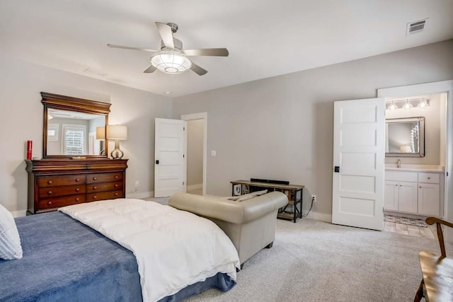 carpeted bedroom featuring ceiling fan, sink, and ensuite bathroom