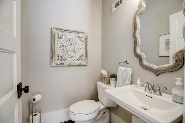 bathroom with sink and toilet