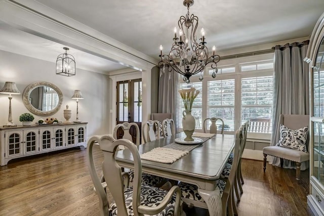 dining space featuring dark hardwood / wood-style flooring and a healthy amount of sunlight