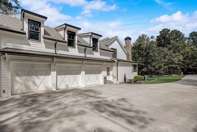 view of side of home with a garage