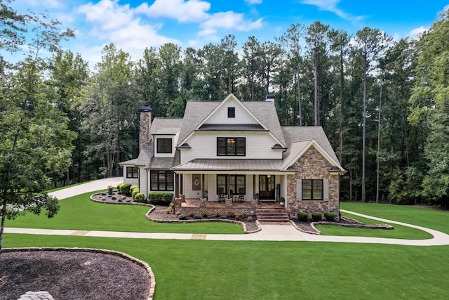 view of front facade with a front lawn and a porch