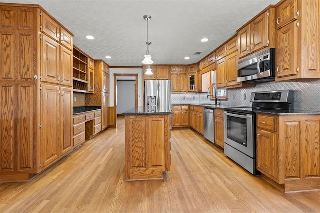 kitchen with tasteful backsplash, appliances with stainless steel finishes, a center island, light wood-type flooring, and open shelves