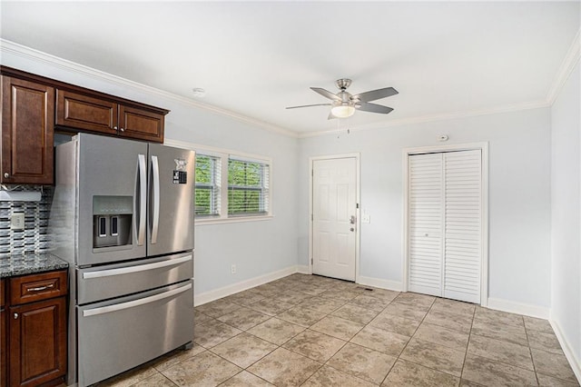 kitchen featuring a ceiling fan, tasteful backsplash, crown molding, baseboards, and stainless steel refrigerator with ice dispenser