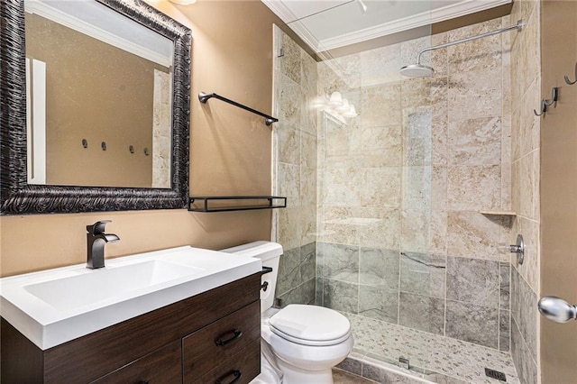 bathroom featuring a shower stall, toilet, ornamental molding, and vanity