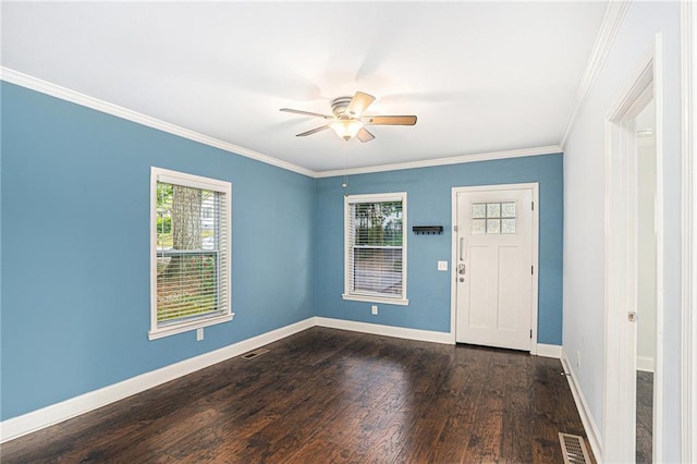 foyer featuring dark wood finished floors, a ceiling fan, a healthy amount of sunlight, and visible vents