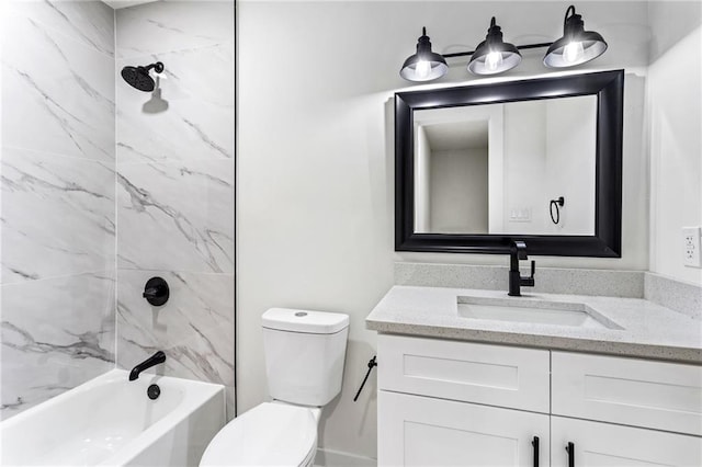 bathroom featuring vanity, bathing tub / shower combination, and toilet