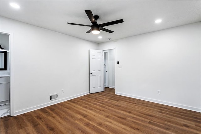 empty room with visible vents, baseboards, ceiling fan, dark wood finished floors, and recessed lighting