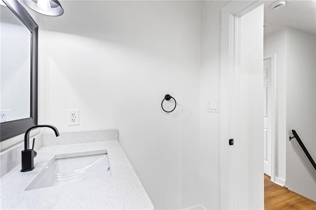 bathroom featuring a sink and wood finished floors