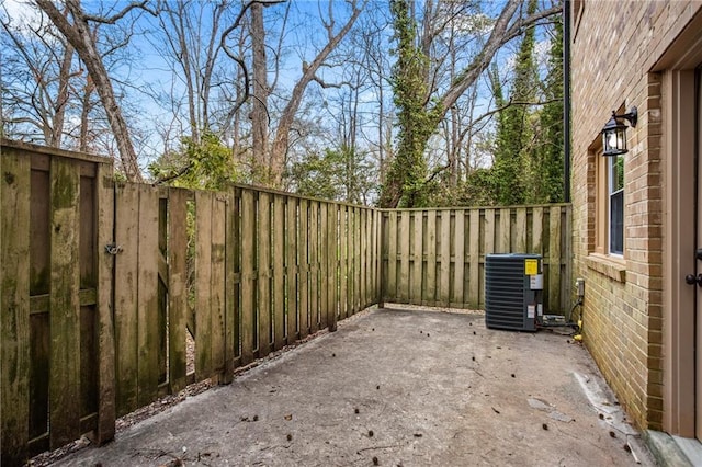 view of patio featuring cooling unit and a fenced backyard