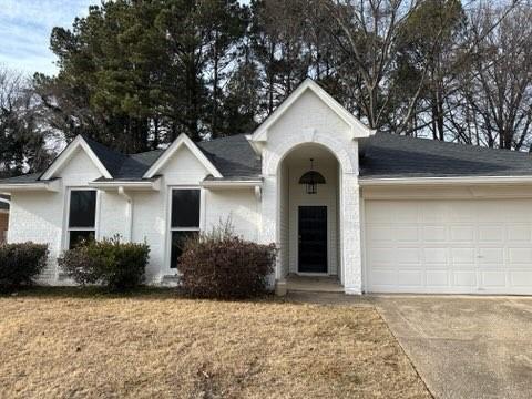 single story home featuring a garage