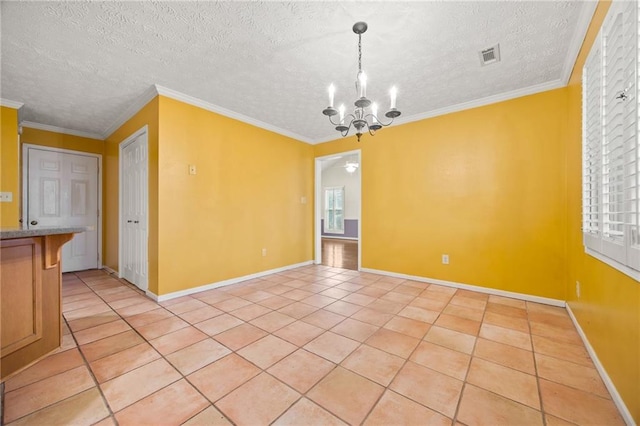 spare room with light tile patterned flooring, an inviting chandelier, crown molding, and a textured ceiling