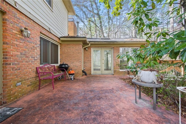 view of patio / terrace featuring a grill and french doors