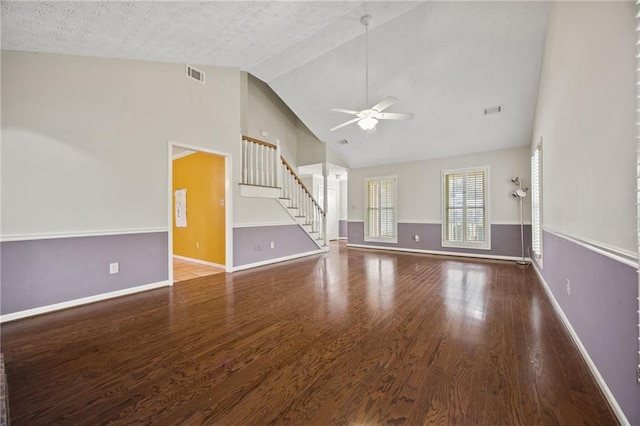 unfurnished living room with ceiling fan, high vaulted ceiling, wood-type flooring, and a textured ceiling