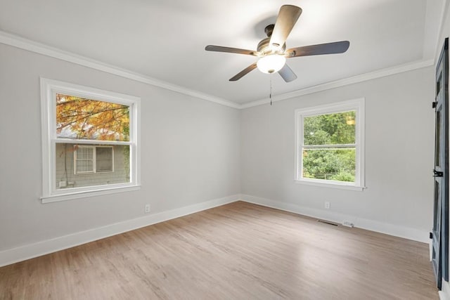 unfurnished room with ceiling fan, light hardwood / wood-style floors, and crown molding