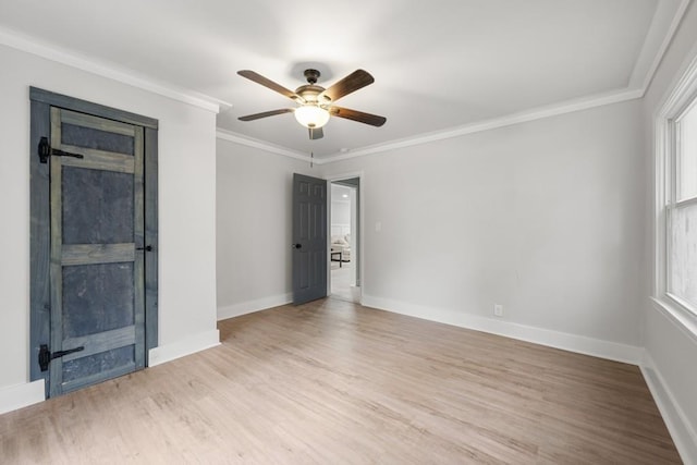 unfurnished room with ceiling fan, light hardwood / wood-style floors, and ornamental molding