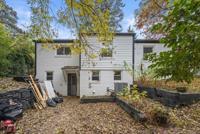 back of property featuring central AC unit