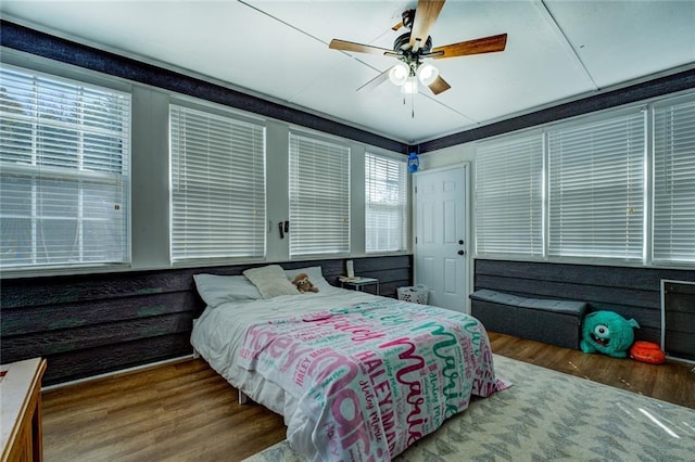 bedroom featuring ceiling fan and wood finished floors