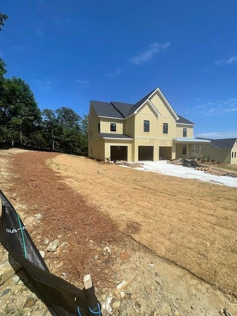 222 Silvercrest Dr, Acworth, GA 30101 - view of home's exterior with a garage and board and batten siding