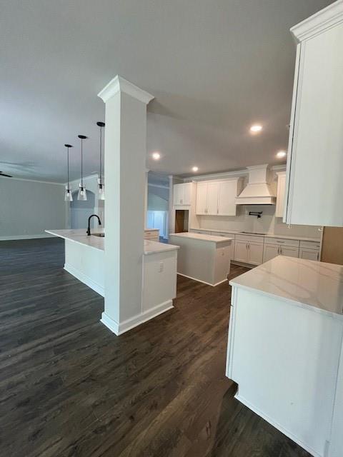 222 Silvercrest Dr, Acworth, GA 30101 - kitchen featuring custom exhaust hood, baseboards, a sink, dark wood finished floors, and white cabinetry