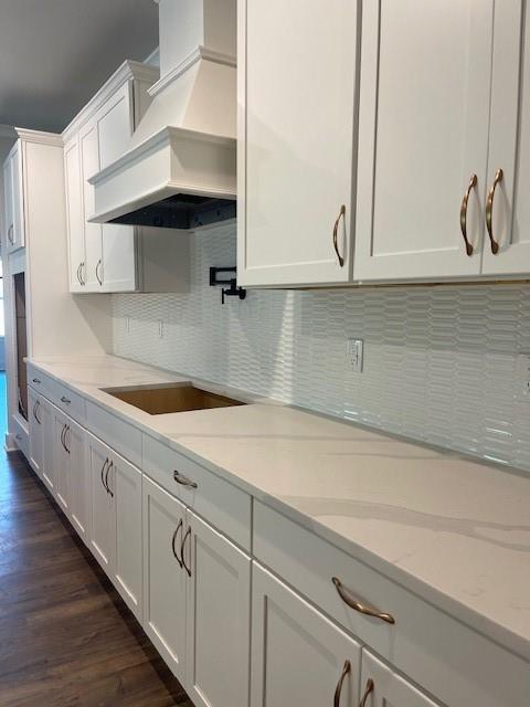 222 Silvercrest Dr, Acworth, GA 30101 - kitchen with custom range hood, black electric stovetop, white cabinetry, and dark wood-style floors